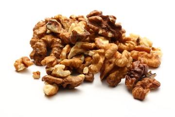 Heap of walnuts on white background