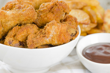 Southern Fried Hot Chicken Wings with bbq sauce & potato wedges