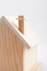 Wooden house maquette on white
