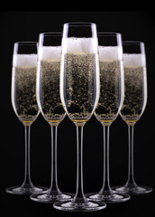 glass of champagne isolated on black background