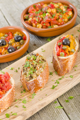 Tapas on Crusty Bread - Spanish tapas on a sliced baguette