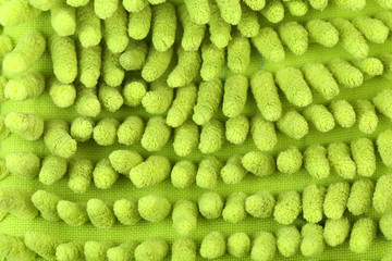 Close up hand bath sponge glove.