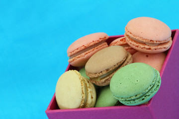 Box of colorful macaroons with copy space