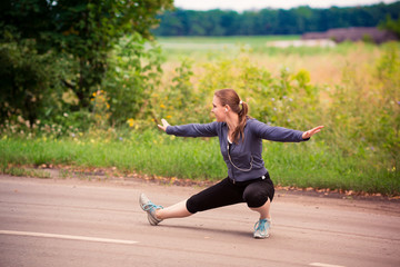 Runner woman stretching in nature outdoor