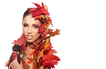 Beautiful woman with autumn leaves on whiite background