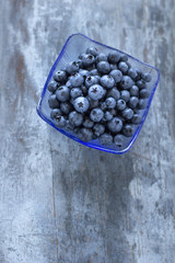 Fresh and delicious blueberries on wooden table