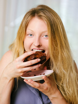 Female Eating A Brownie