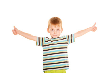 Happy little boy showing a thumbs up