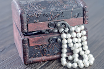 Old wooden chest with perl