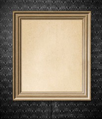 Elegant simple empty wooden frame with on vintage wallpaper