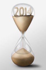 Hourglass with 2014 year made of sand. Concept of time