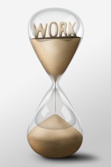 Hourglass with Work made of sand. Concept of uncertainty