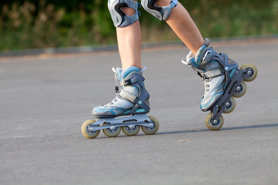 roller skates on beautiful girl's feet