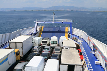 ferry boat loaded with cars and trucks - 54860561
