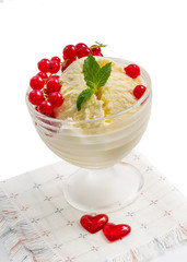 Vanilla ice cream with red currants on a white background