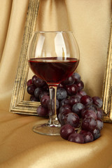 composition of frame,wine and grapes on bright background
