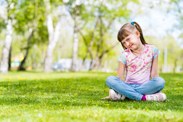 portrait of a smiling girl in a park