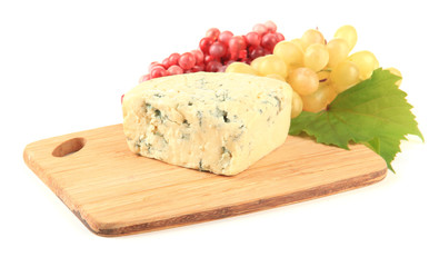 Tasty blue cheese and grape on cutting board, isolated on white