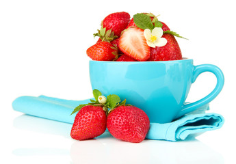 Ripe sweet strawberries in blue cup, isolated on white
