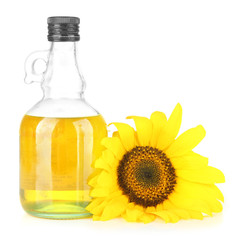 Oil in jar and sunflower isolated on white