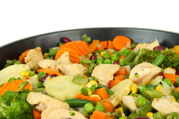 Casserole with vegetables and meat on pan, isolated on white