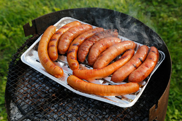 bbq grill with sausages on the grill