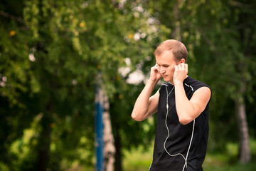 Fototapeta premium Sportive young man jogging outdoor