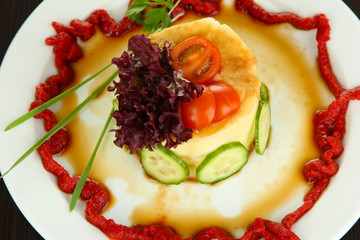 Small portion of food on big plate close up