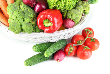 Fresh vegetables in white wicker basket close up