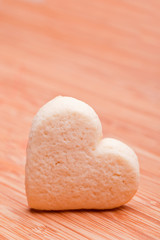 homemade heart cookies on wooden background