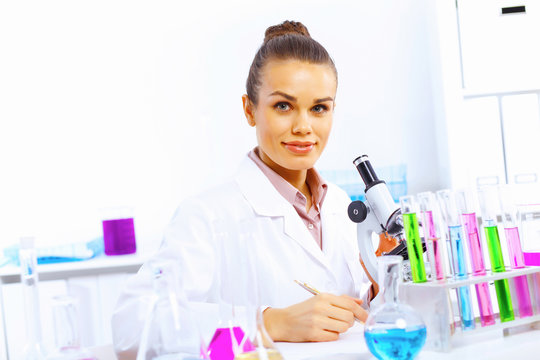 Young female scientist working in laboratory