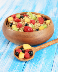 Oatmeal with fruits on table close-up