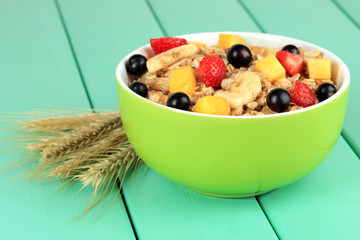 Oatmeal with fruits on table close-up