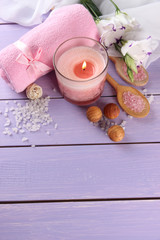 Beautiful spa setting with pink candle and flowers