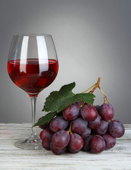 Ripe delicious grapes with glass of wine