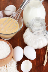 Ingredients for dough on wooden table close-up