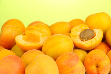 Fresh natural apricot on green background