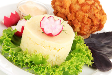 Chicken Kiev on croutons with mashed potatoes, isolated on
