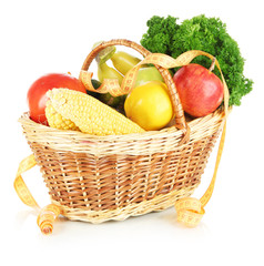 Fresh vegetables in wicker basket isolated on white