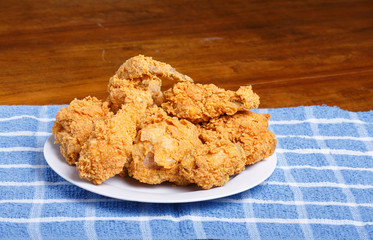 Fresh Fried Chicken on Blue Plaid Placemat and Wood Table