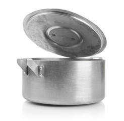Old aluminum saucepan with open cap on white background.