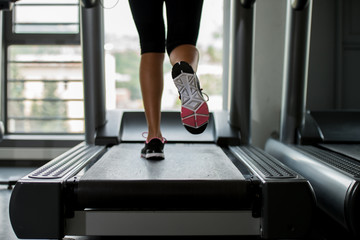 girl running on treadmill