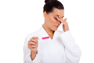 woman scared to see result of pregnancy test