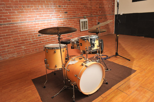 Set of drums in a brick and wood studio