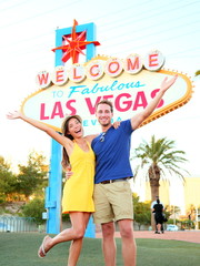 Las Vegas Sign - couple jumping having fun