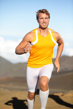 Sport fitness running man sprinting outside