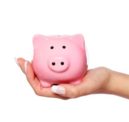 Piggy bank in female hand isolated on white background. Savings