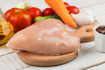 Fresh chicken on wooden table