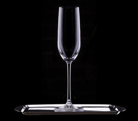 empty glass of champagne on black background