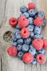 Berries on Wooden Background.